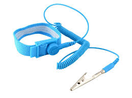 Technician wearing an ESD wrist strap connected to a ground